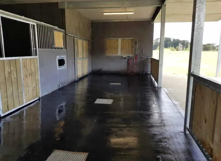 Rubber mats through a stable walkway